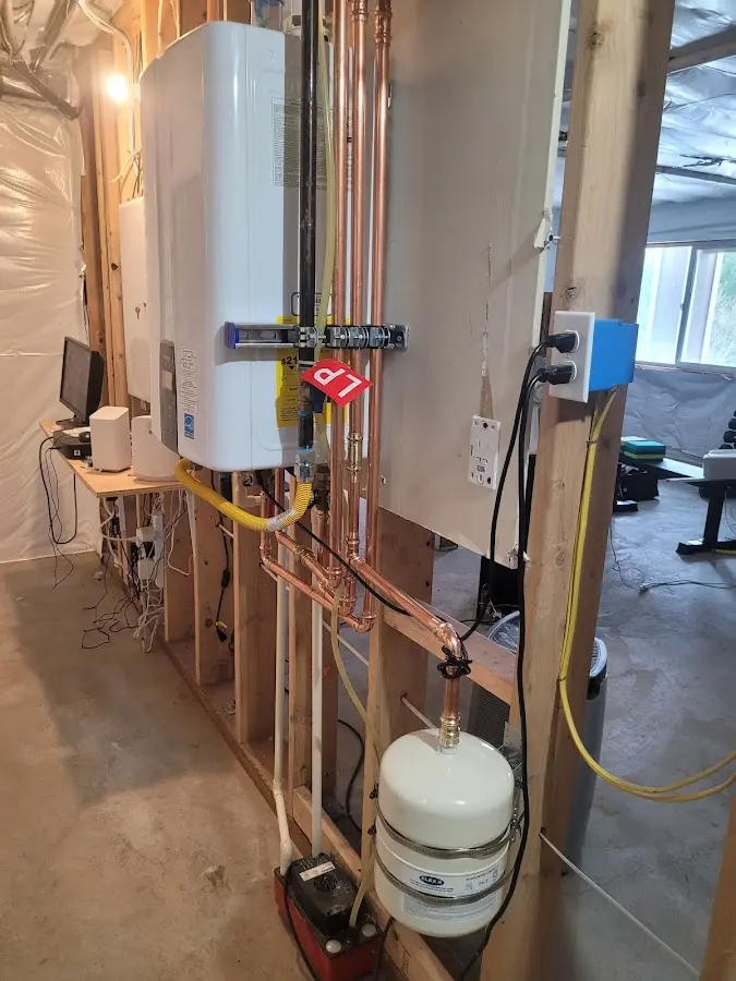 Licensed plumber repairing a kitchen sink in Montvale
